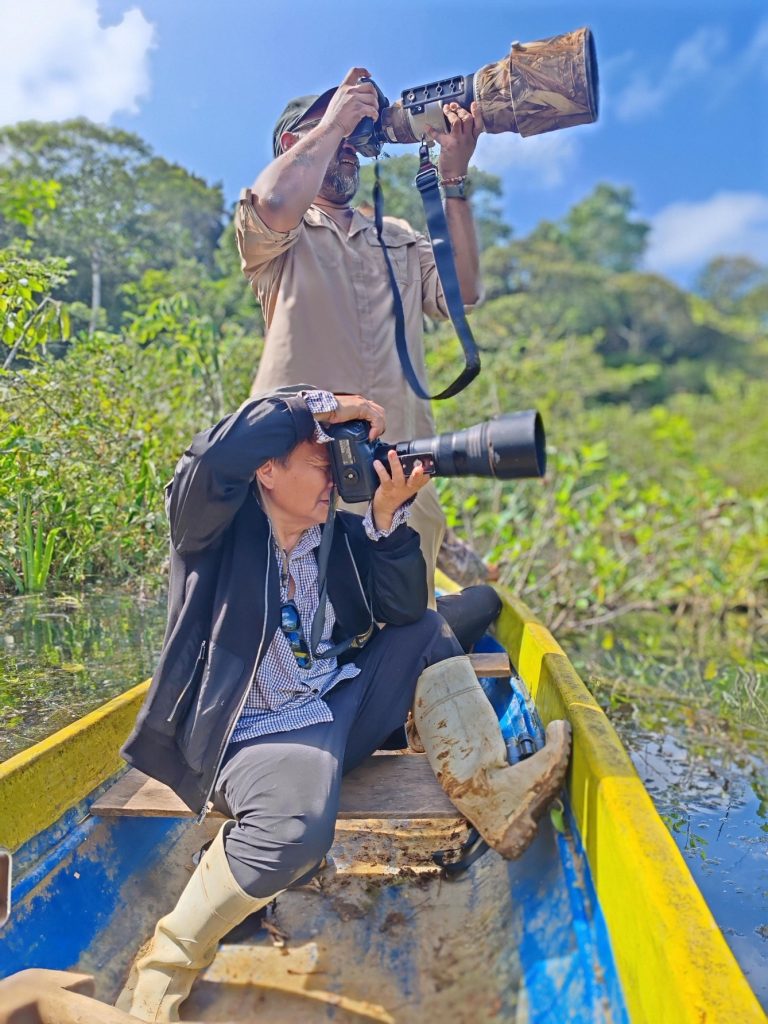 Working from a small rowboat, balancing gear, light, movement, and distance.